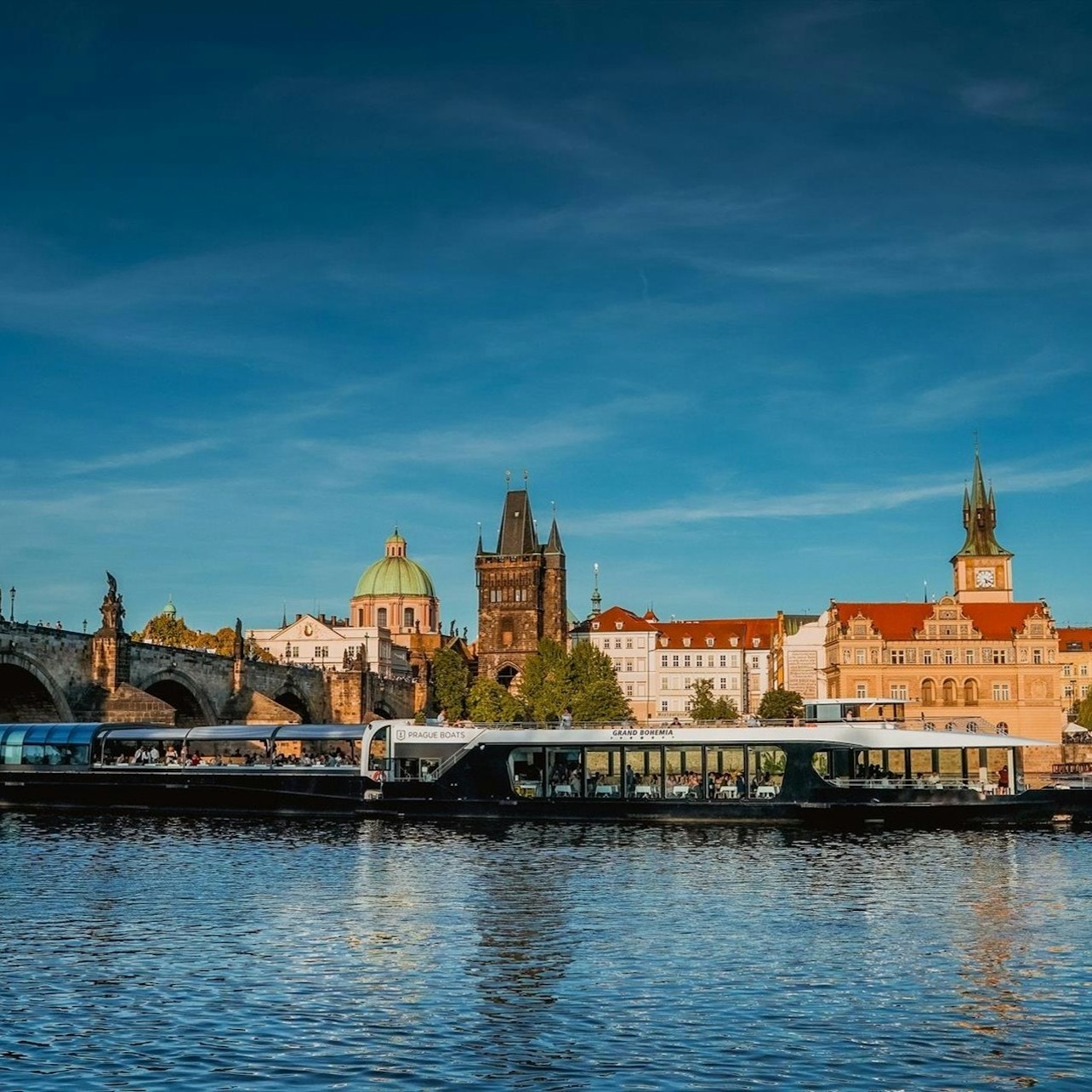 Experience Prague’s beauty aboard a 2-hour river cruise passing historic sites like the Charles Bridge and the stunning Prague Castle while enjoying refreshing drinks on deck.